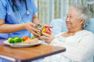 Nutrition Nurse serving a patient